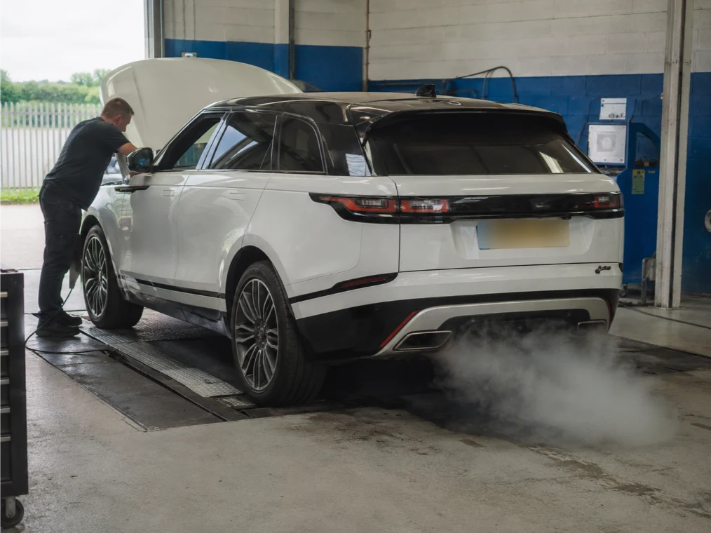 White Smoke coming out of car engine due to overheating issue